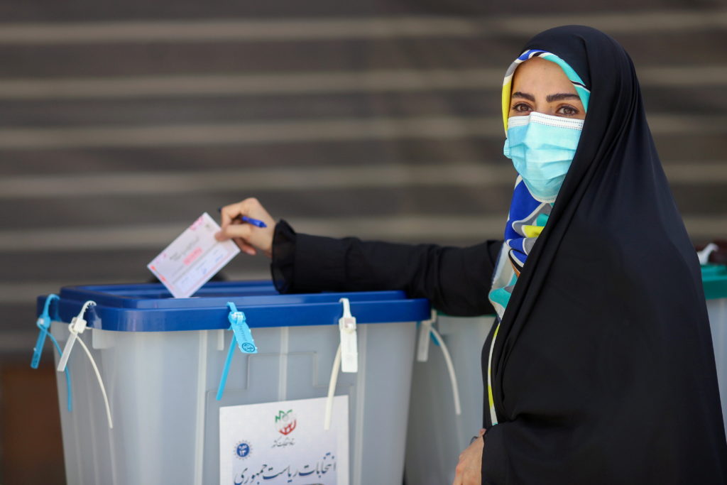 Iran votes in presidential poll tipped in hard-liner’s favor