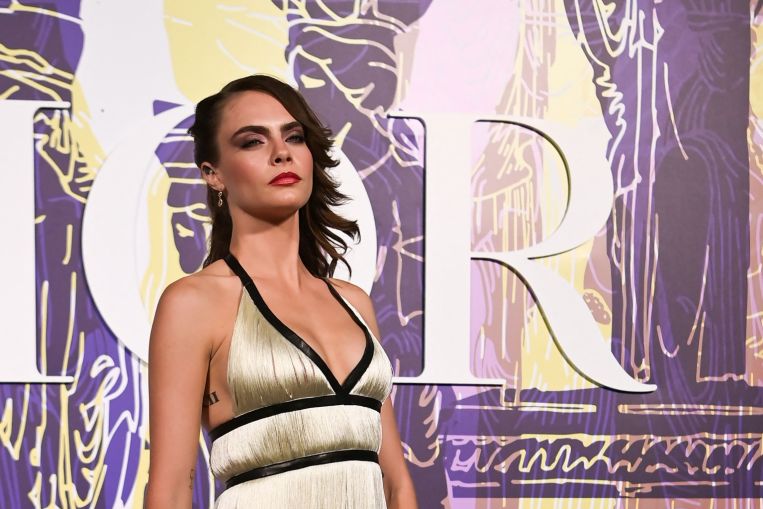 Cara Delevingne has considered a boob job as she thinks her breasts are uneven, Entertainment News & Top Stories