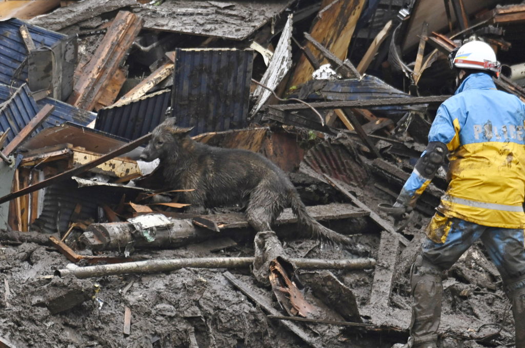 Japan searches for dozens missing in mudslide; 4 dead