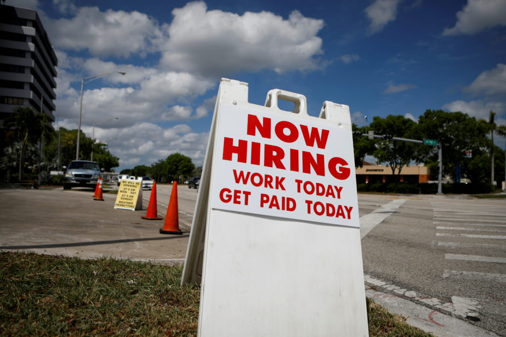 Worker pay rises strongly as businesses fight to fill jobs