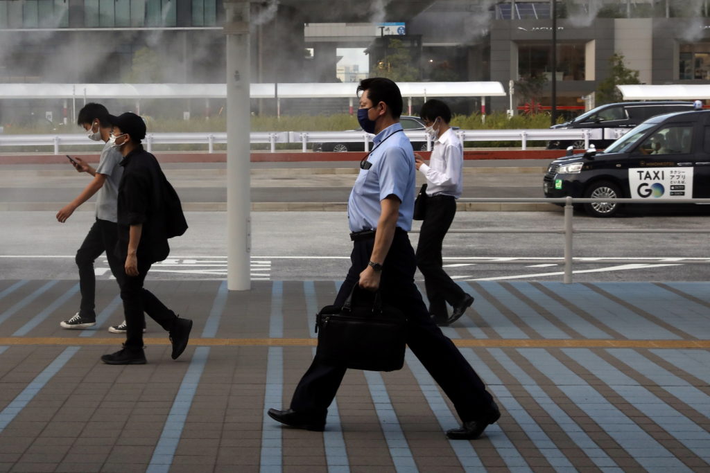 Officials in Tokyo alarmed as virus cases hit record highs