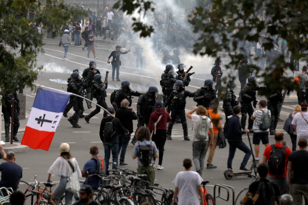 French police clash with anti-virus pass protesters in Paris