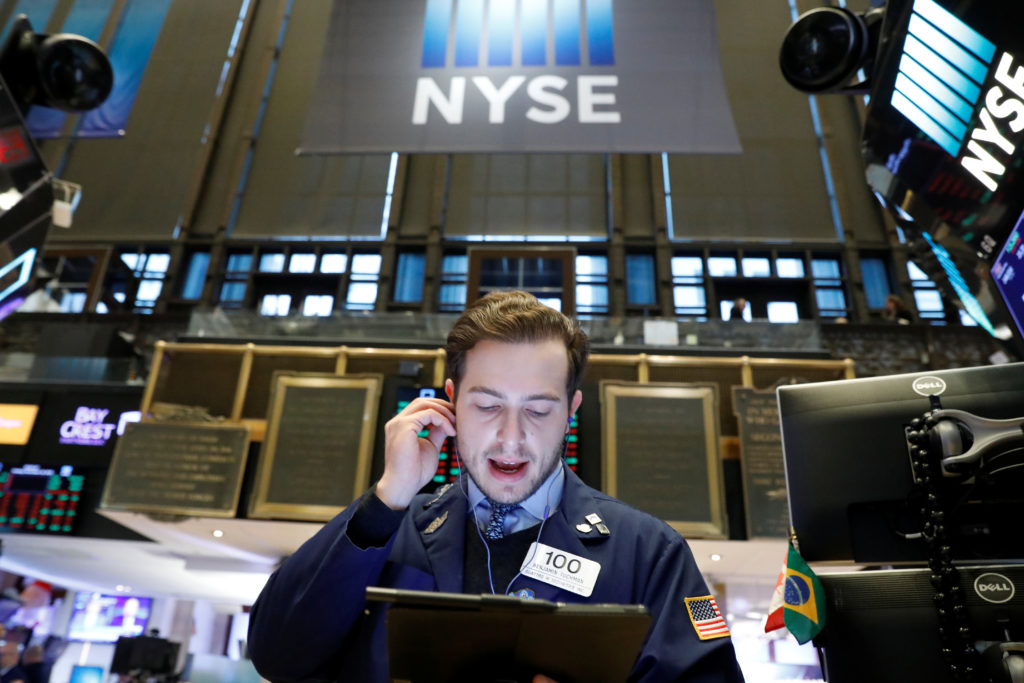 Stocks skid as investors fear virus surge will dent recovery