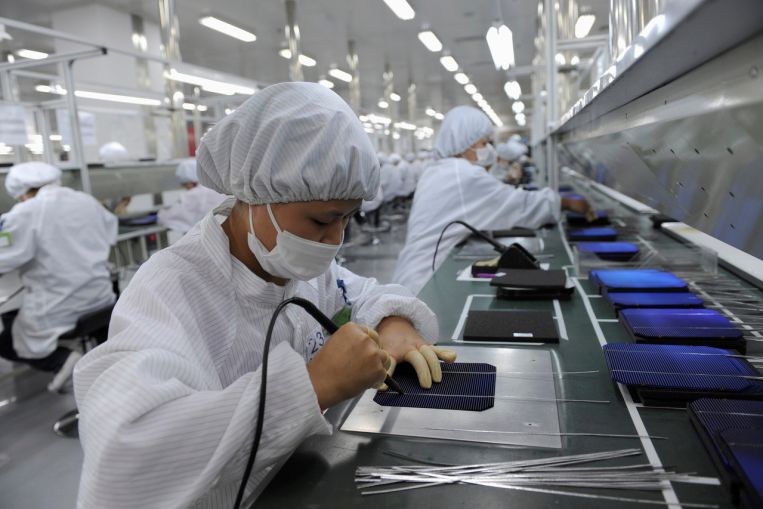 Asia factories see momentum weaken on rising costs, new Covid-19 curbs, Economy News & Top Stories