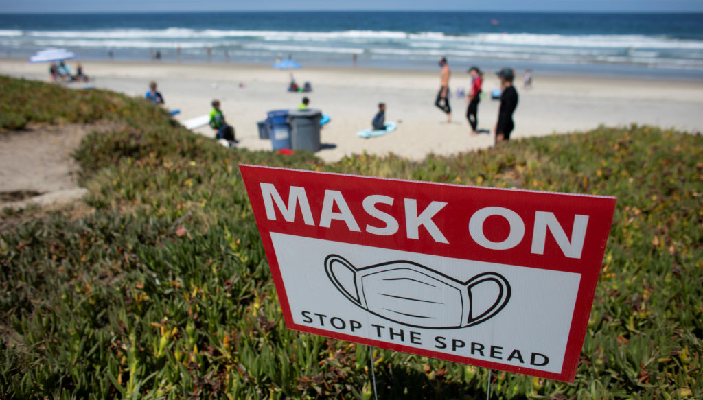 California brings again masks mandate throughout vacation season as virus instances rise