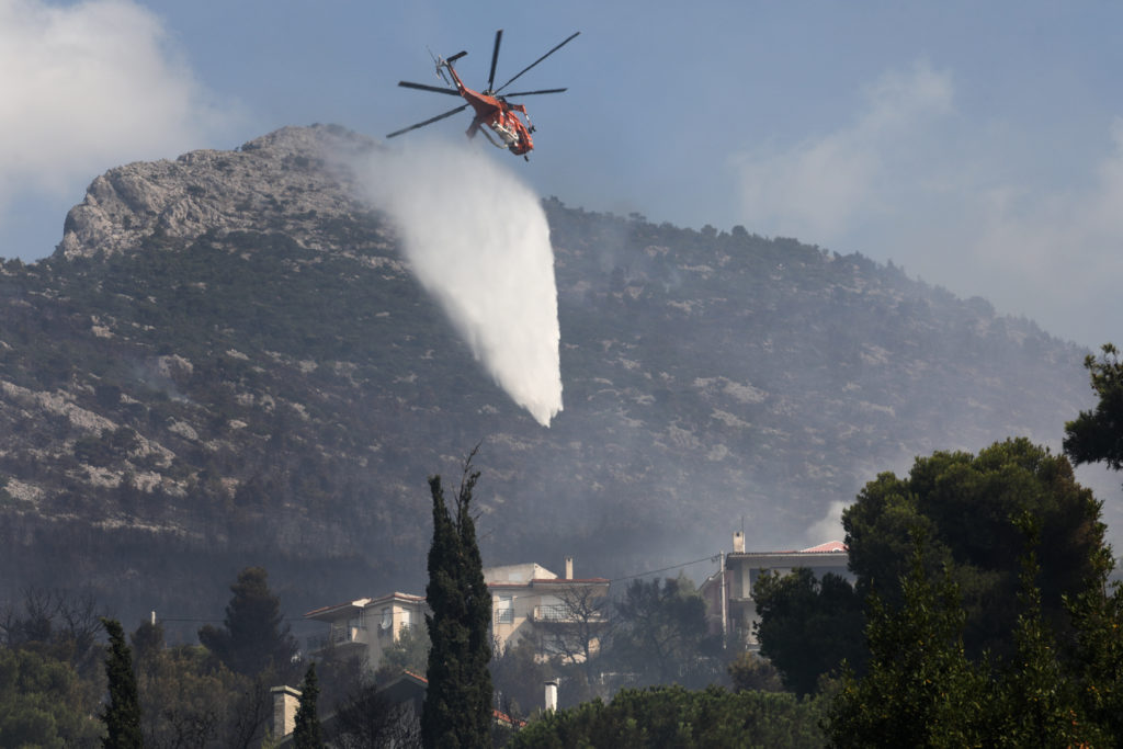 Wildfires rampage in Greek forests, cut large island in half