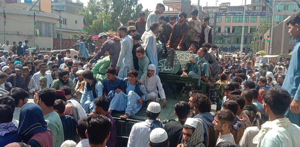 Desperate Afghans try to flee as government collapses, Taliban take control