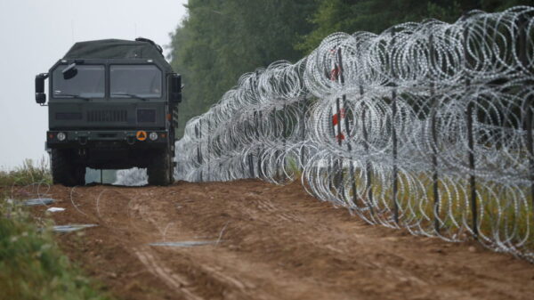 Polish lawmakers approve anti-migrant wall on Belarus border