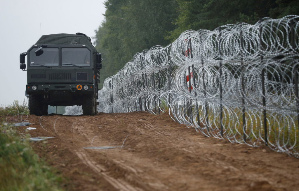 Polish lawmakers approve anti-migrant wall on Belarus border