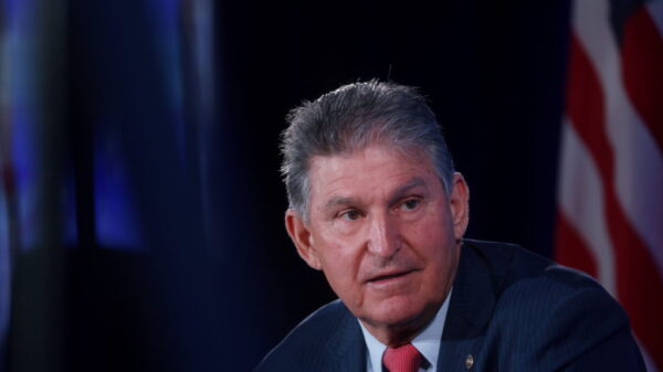 Paid family leave, billionaire tax likely cut from spending bill over Manchin opposition