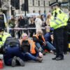 Climate protesters block roads outside UK Parliament