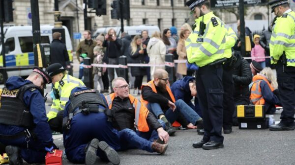 Climate protesters block roads outside UK Parliament