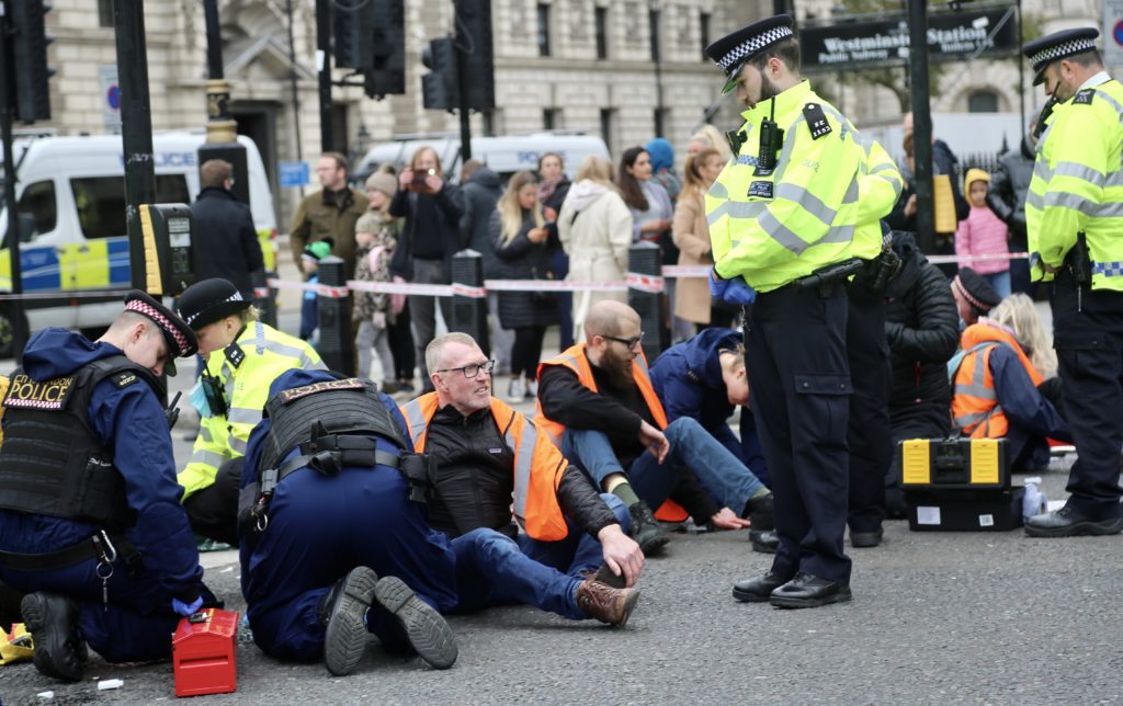 Climate protesters block roads outside UK Parliament