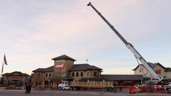 Outlets at Castle Rock trims 55-foot white fir Christmas tree