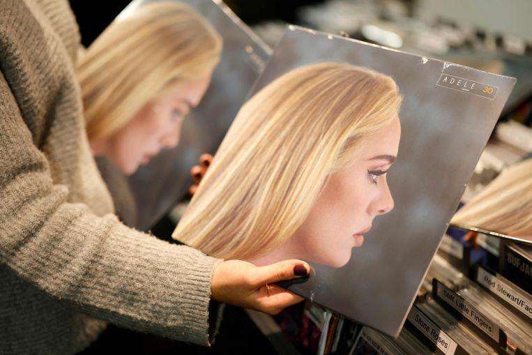 Adele scores uncommon double on British music charts, Leisure Information & High Tales