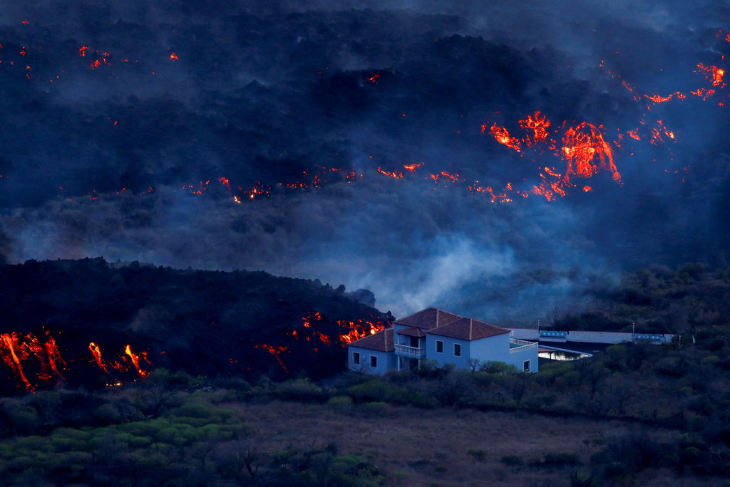 Volcanic lava imperils church, properties on Spain’s La Palma island