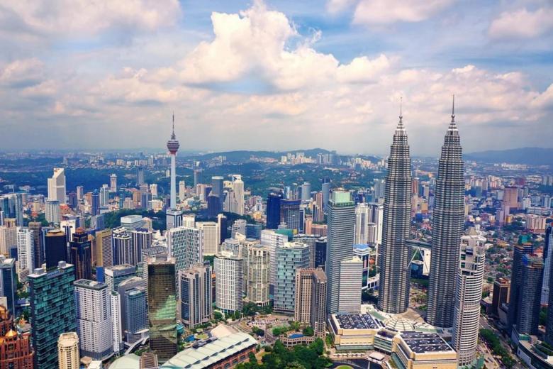 So close to but thus far: A Singapore household travels to Kuala Lumpur after two years