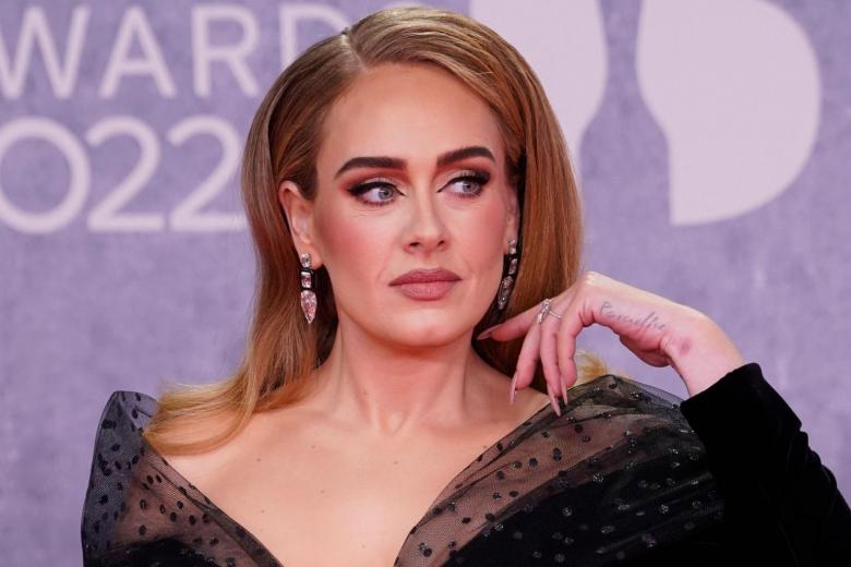 Adele sparks engagement rumours with large diamond ring at Brit Awards